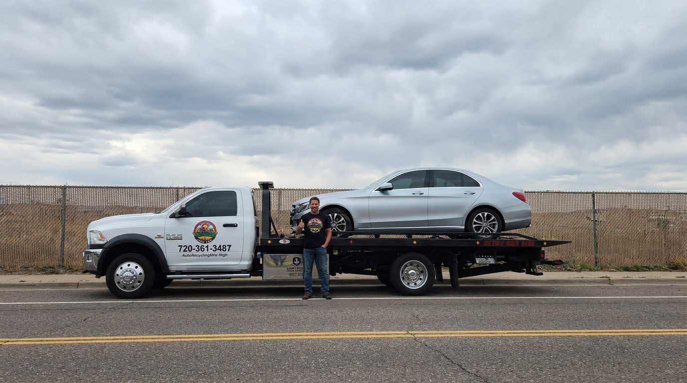 2018 Mercedes-Benz C 300 loaded on an Auto Recycling Mile High tow truck at a cash-for-cars pickup in the Denver metro
